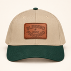 Model mockup of Blessed & Highly Favored Leather Patch Baseball Cap, Khaki / Dark Green / Light Brown patch / Rectangle colorway