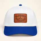 Model mockup of Blessed & Highly Favored Leather Patch Baseball Cap, Royal / White / Light Brown patch / Rectangle colorway