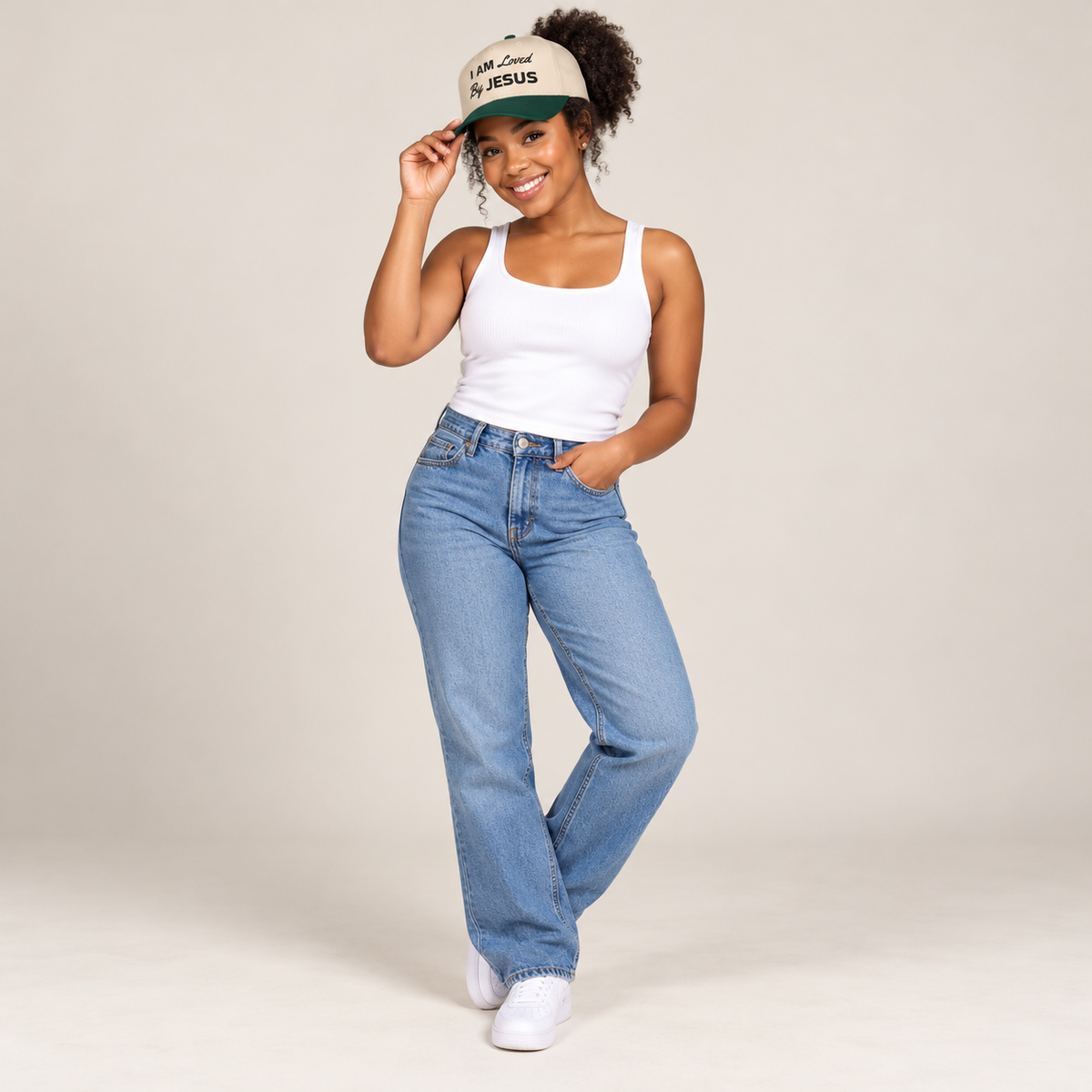 Solo smiling model wearing I am Loved By Jesus - Cap, Dark Green / Natural