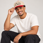 Solo smiling model wearing I am Loved By Jesus - Cap, Red / Natural