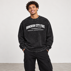 Solo smiling model wearing DCFIRE - Oversize Long Sleeve T-Shirt, Black Beauty