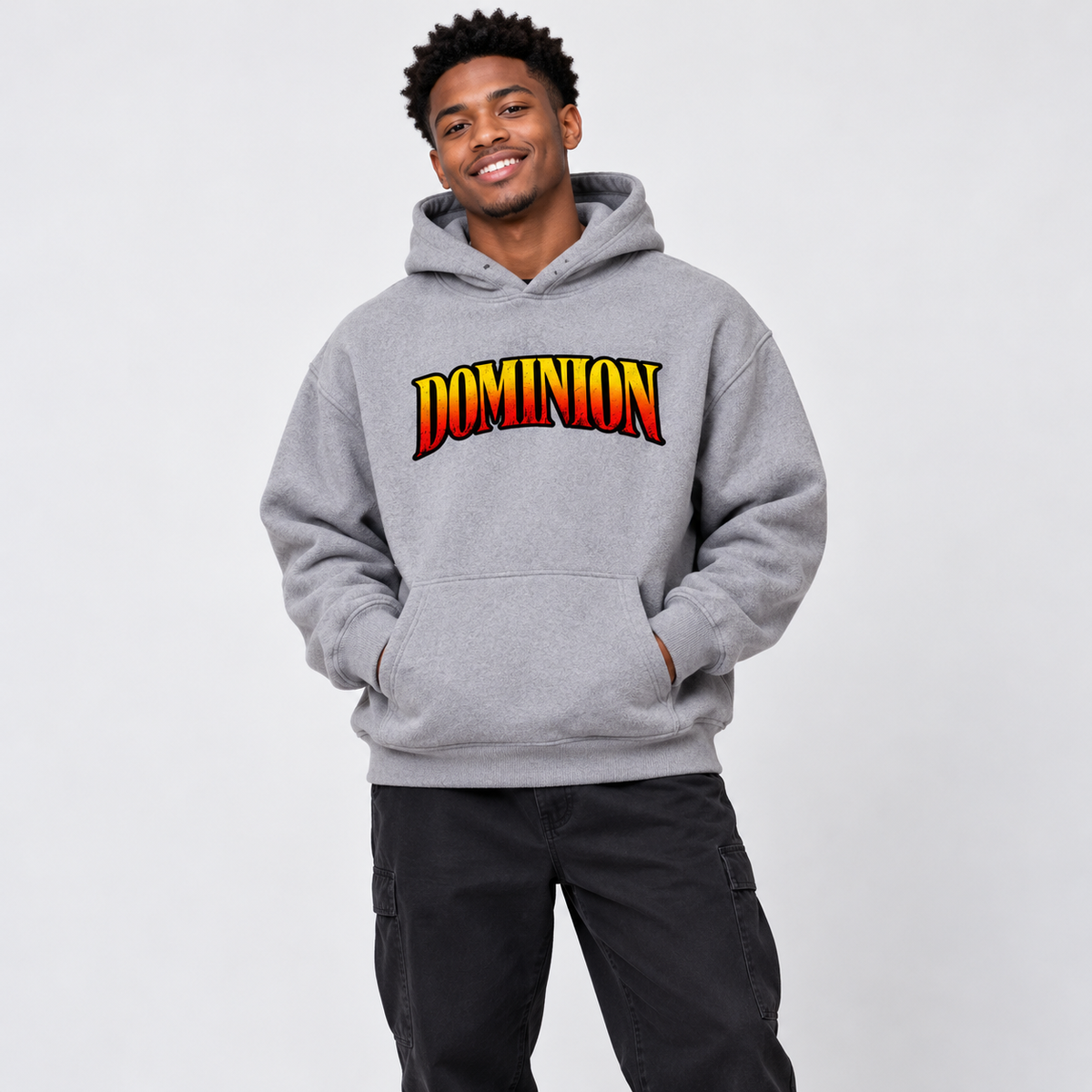 Solo smiling model wearing Dominion hoodie, Gray