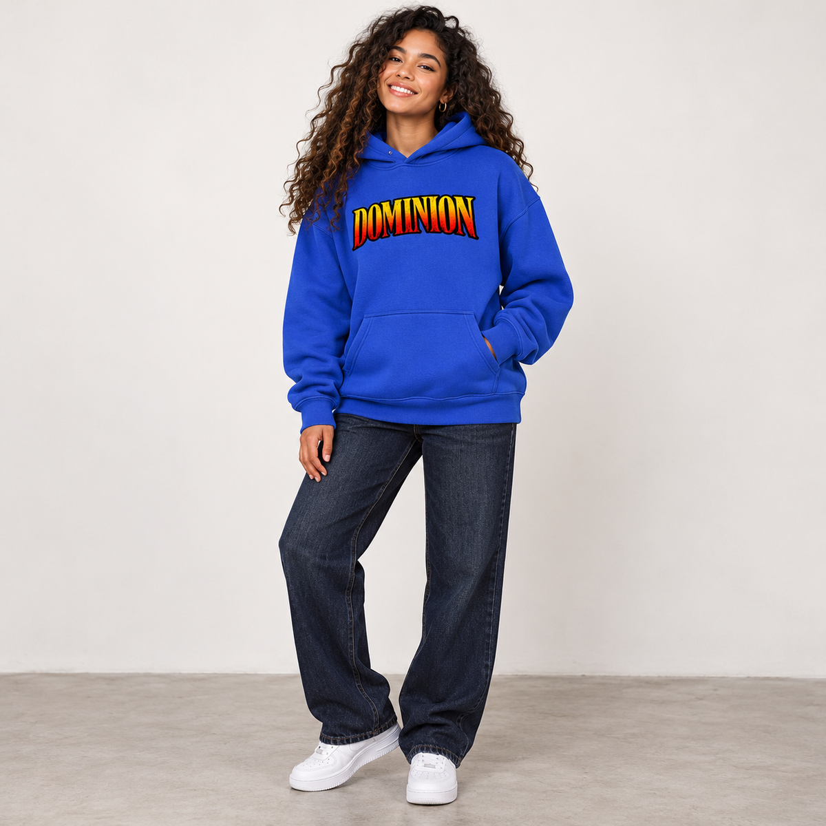 Solo smiling model wearing Dominion hoodie, Klein Blue