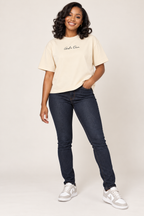 Mild Apricot God's Own Boxy Oversized Tee worn by smiling young female model in jeans