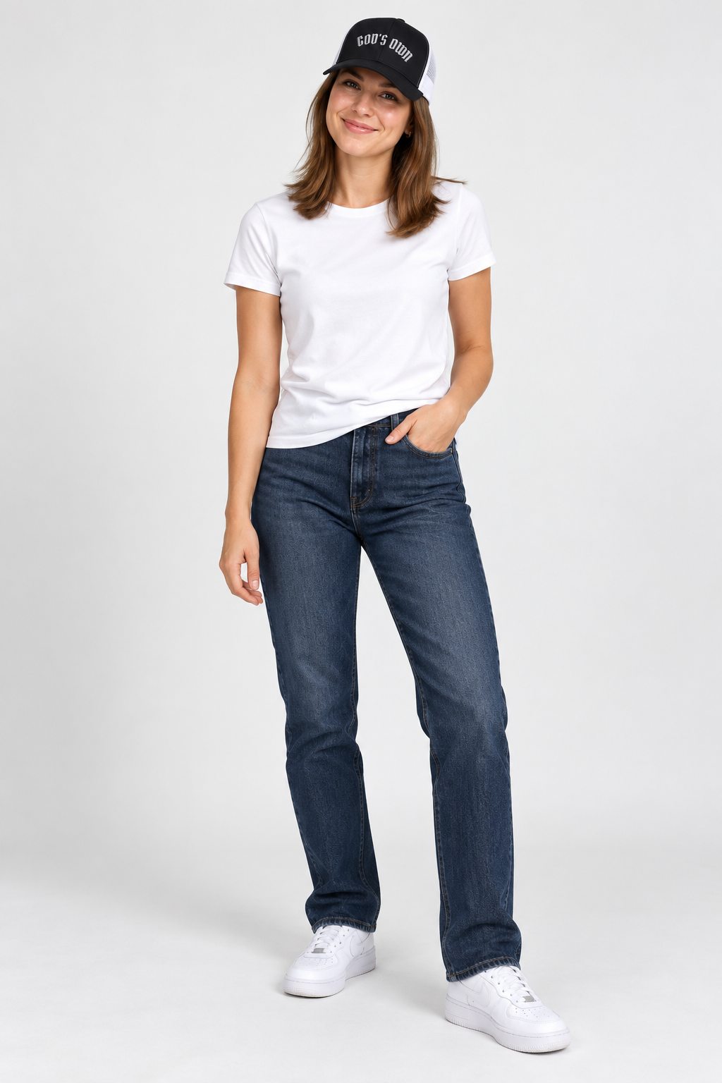 Smiling female model wearing the Black and White God’s Own trucker cap